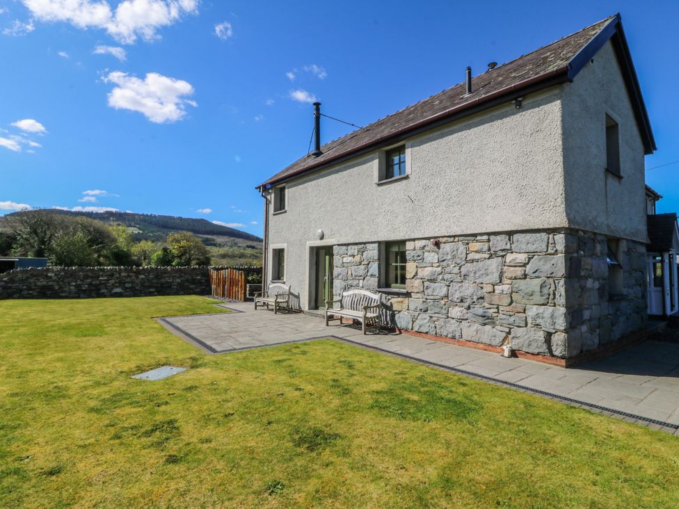 A house exterior with garden and patio at Bronfa Tregarth