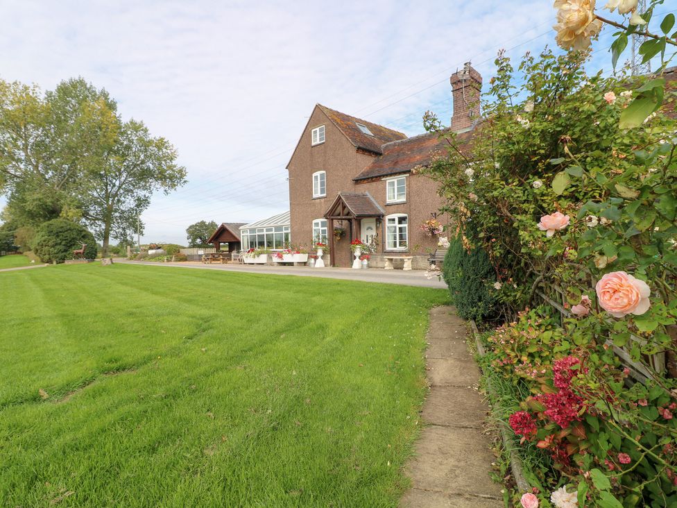 A house with garden and pathway at Far Coley Farm and Kilnhurst Log Cabin Great Haywood