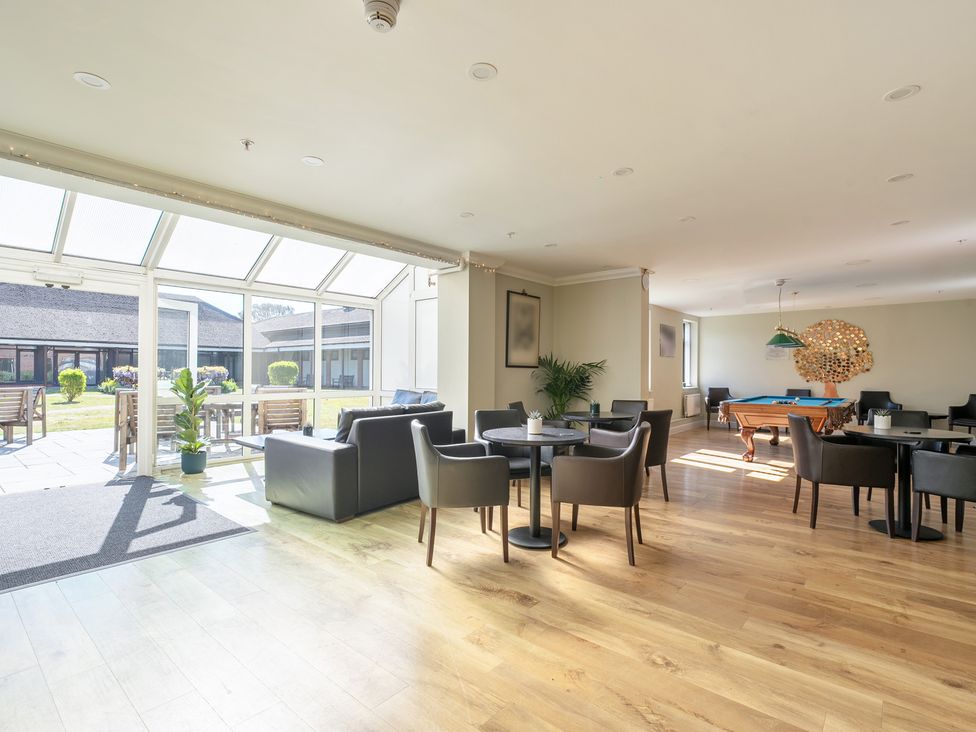 A lounge area with seating and a pool table at Marine Court Three Bedroom Second-floor Apartment 35 Littlehampton