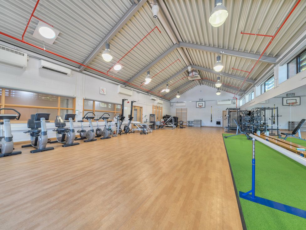 A gym with exercise bikes and weight machines at Marine Court Three Bedroom Second-floor Apartment 35 Littlehampton