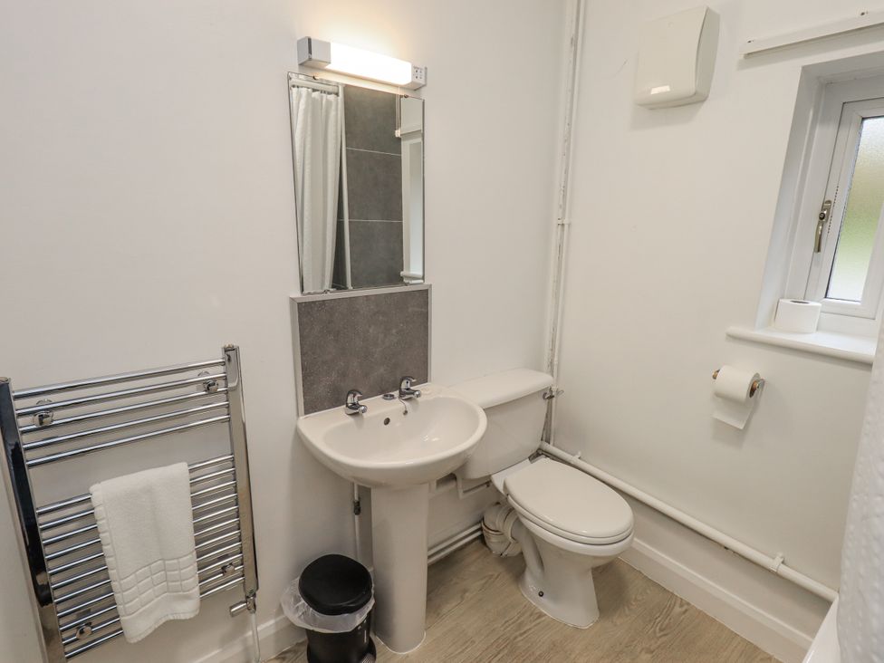 A bathroom with a sink and toilet at 1 Eamont Park Penrith