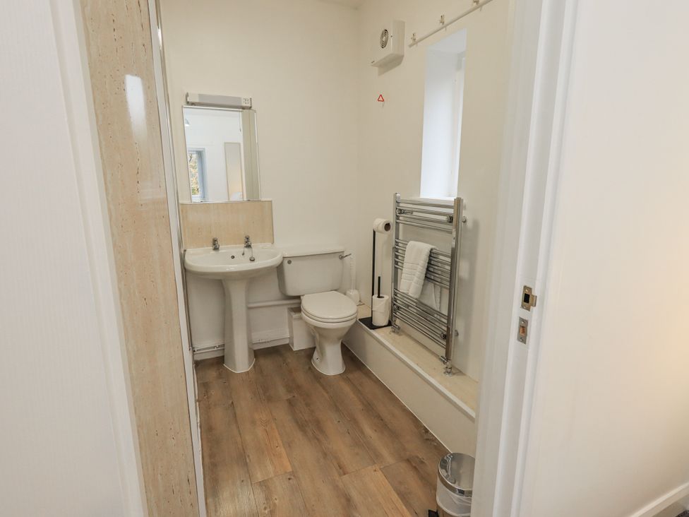 A bathroom with a sink and toilet at 1 Eamont Park in Penrith