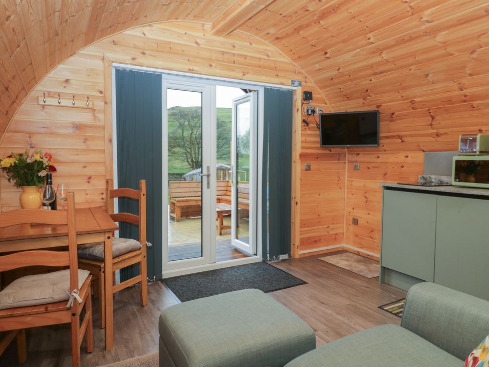 A living room with a dining area and kitchen at Beech in Ulverston