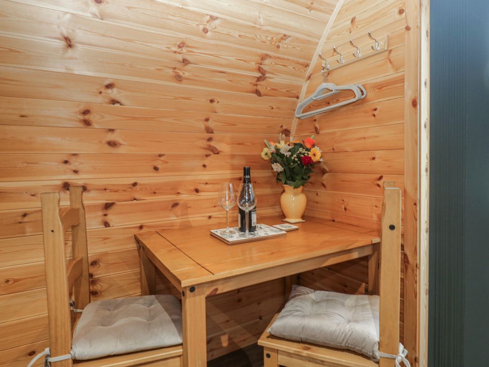 A dining area with a table and chairs at Beech in Ulverston