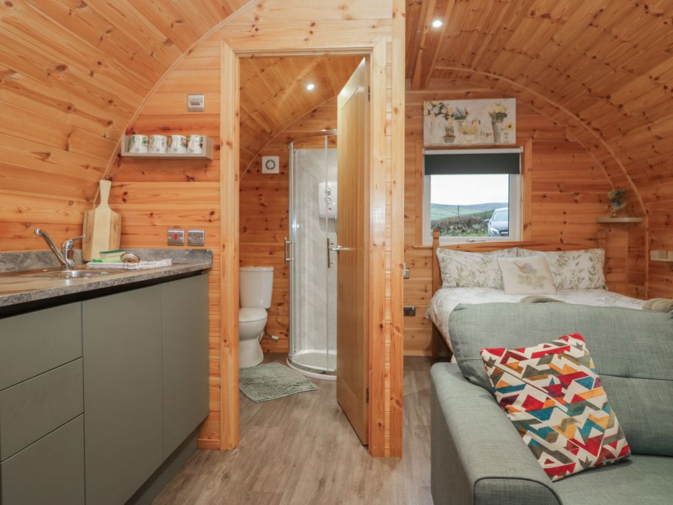 A studio with kitchen, bathroom and sleeping area at Beech in Ulverston