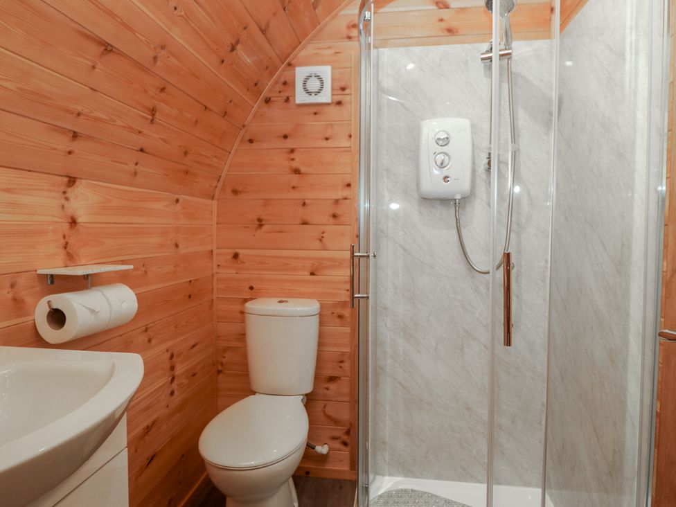 A bathroom with a shower and toilet at Beech in Ulverston