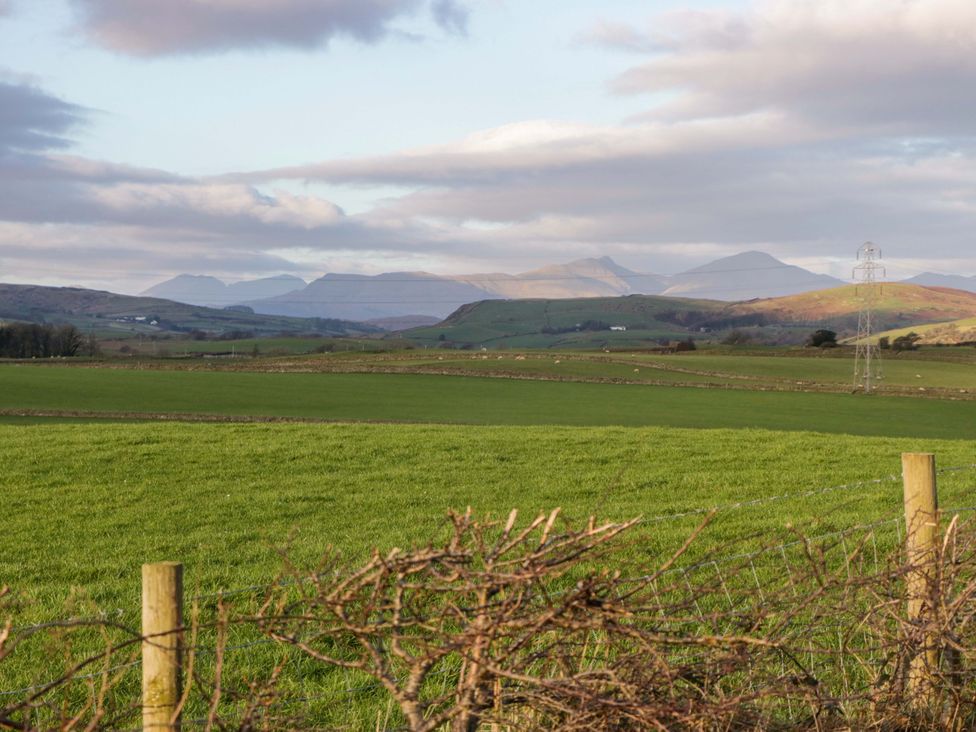 A landscape with grass fields and distant hills at Beech in Ulverston