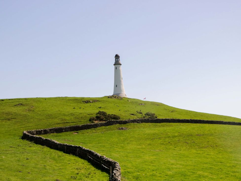 A lighthouse on a hill surrounded by grass at Beech in Ulverston