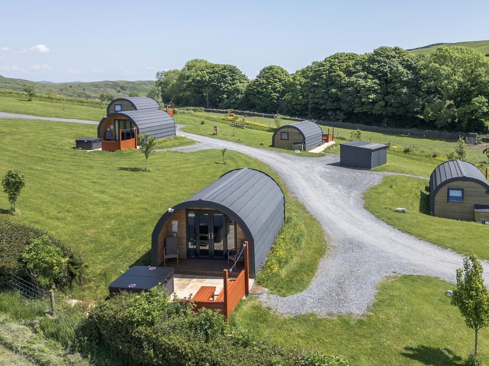 A view of several huts on a grassy area at Beech in Ulverston