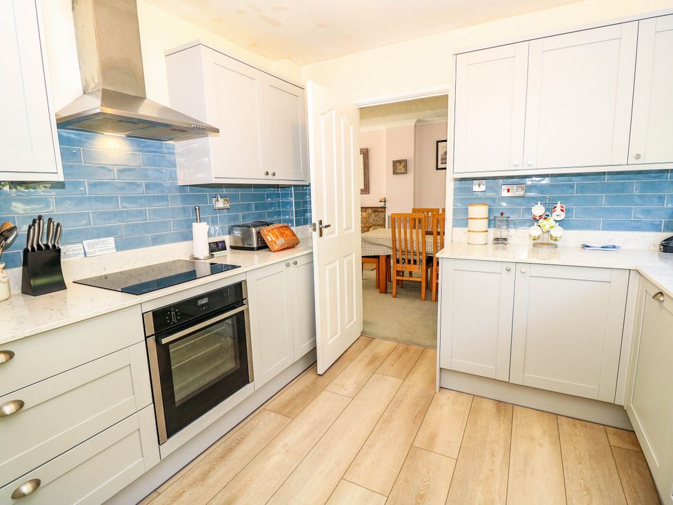 A kitchen with cabinets and appliances at Altair Colwell Bay near Freshwater