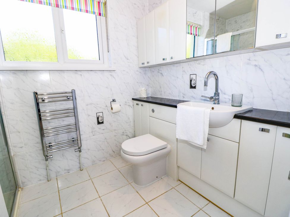 A bathroom with a sink and toilet at Altair in Colwell Bay near Freshwater