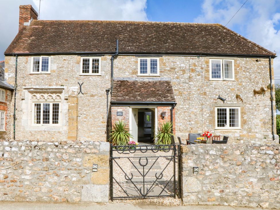 A house with a gate and plants at The Abbey Grange near Charmouth