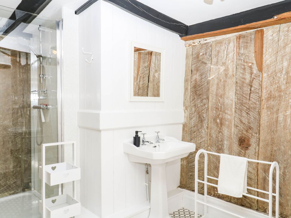 A bathroom featuring a sink and shower at The Abbey Grange near Charmouth