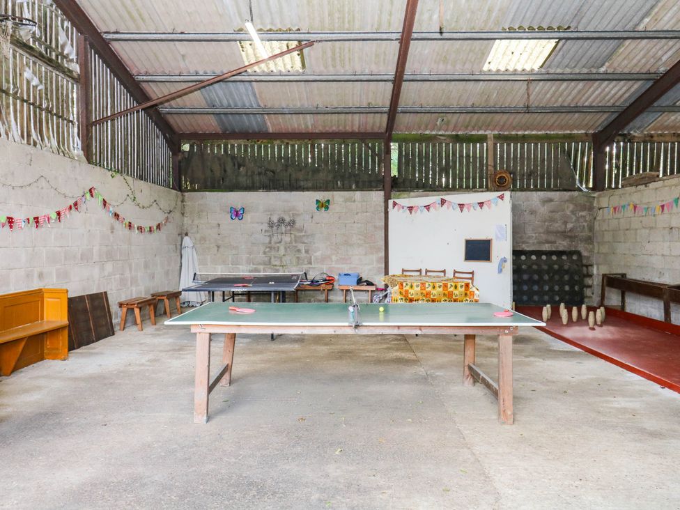 A games room with a ping pong table at The Abbey Grange near Charmouth