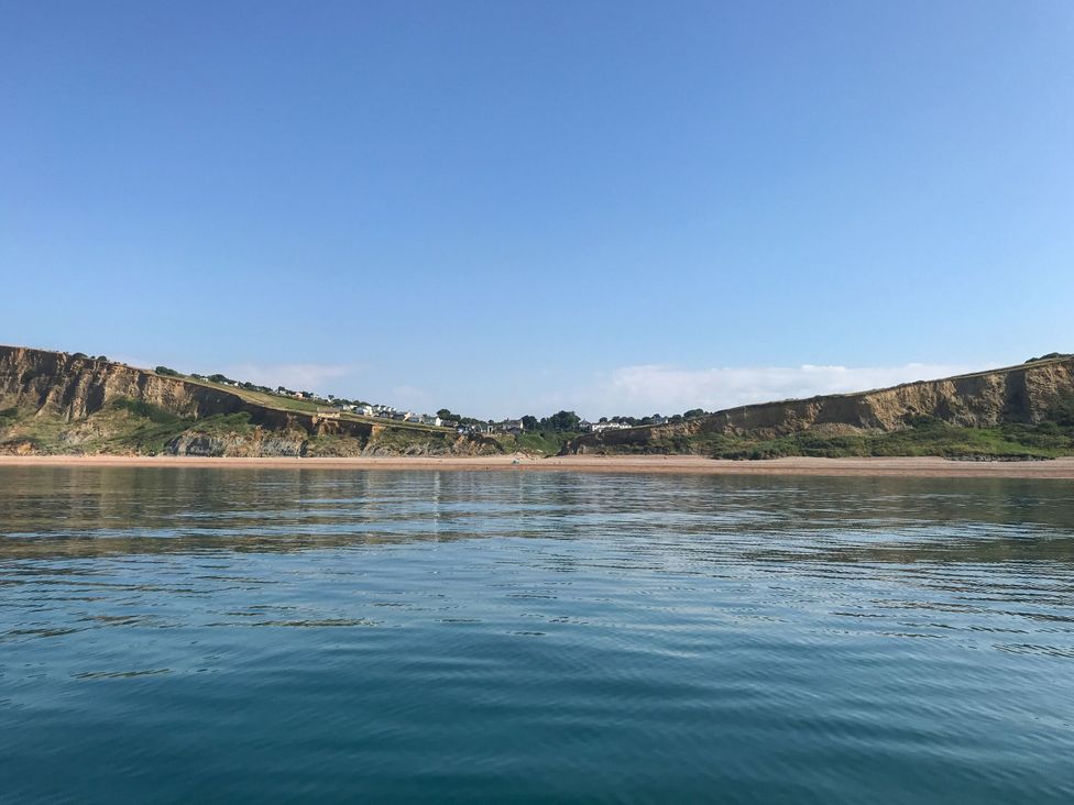 A view of cliffs and beach from the water at The Abbey Grange near Charmouth
