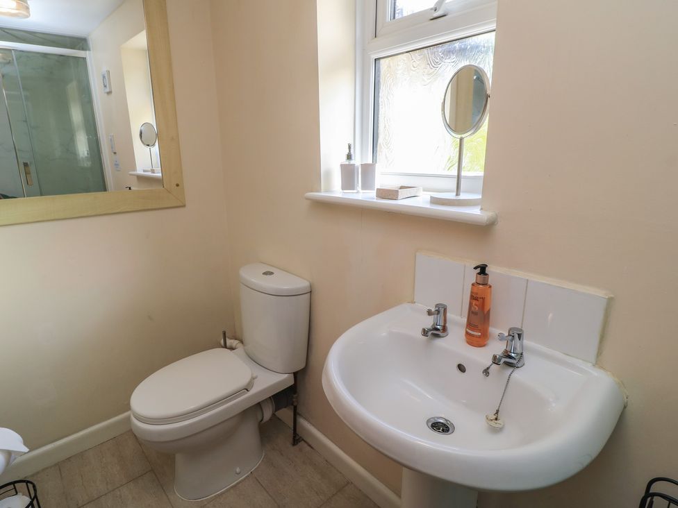 A bathroom with a toilet and sink at Ryecross Farm Cottage in Shaftesbury