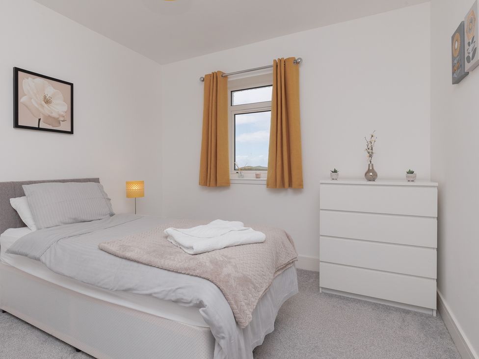 A bedroom with a bed and chest of drawers at Dun Buidhe South Boisdale near Daliburgh Isle Of South Uist