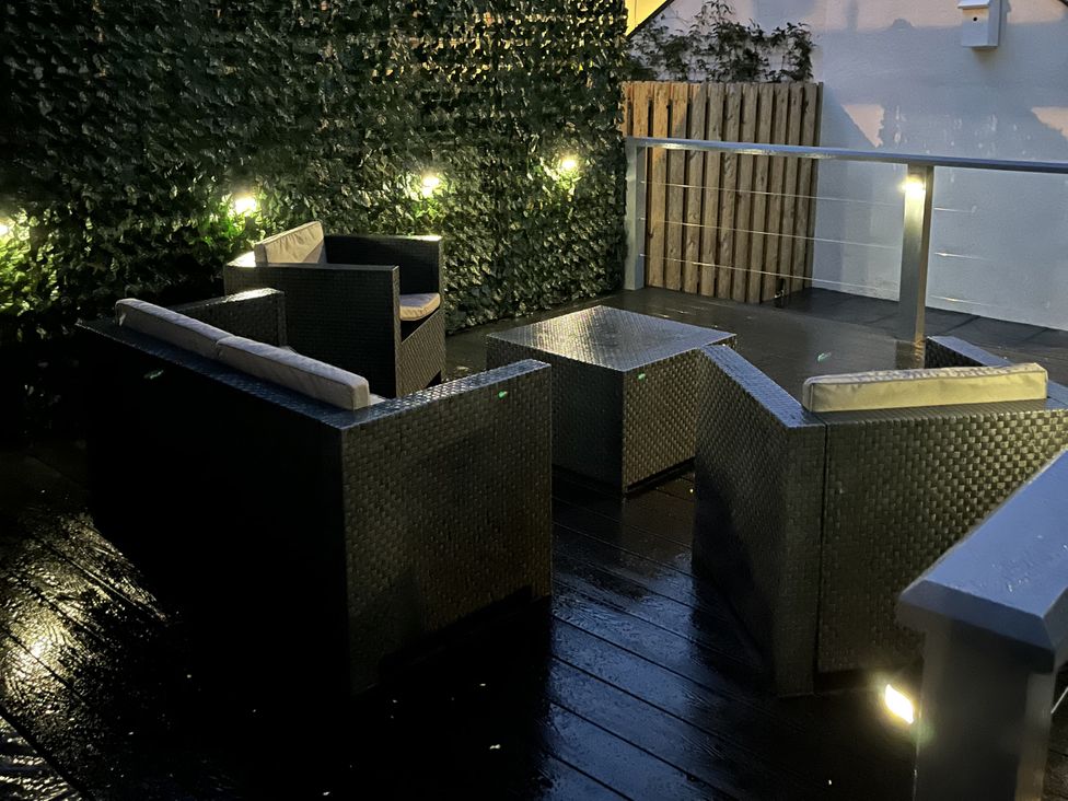 An outdoor seating area with furniture at Y Berth in Llanberis
