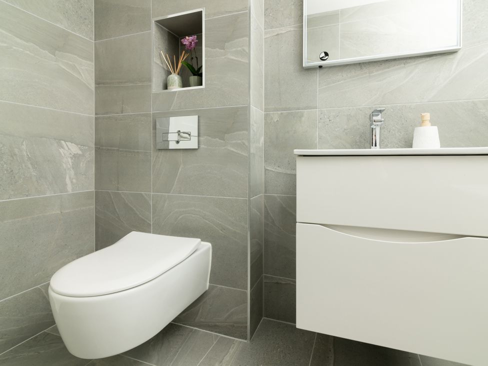 A bathroom with a toilet and sink at Sandy Cove in Praa Sands