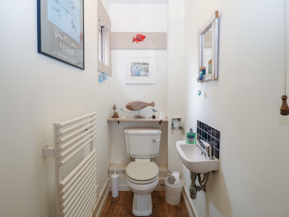 A bathroom with a toilet and sink at Kipper Lodge in Dartmouth