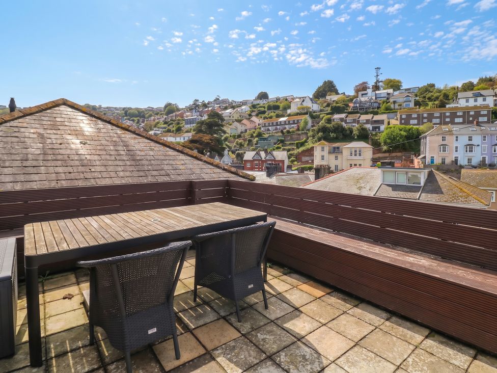 An outdoor area with a table and chairs at Kipper Lodge in Dartmouth