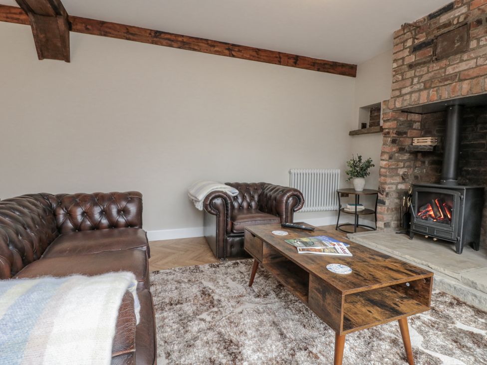 A living room with a sofa and a coffee table at Betsy's Burrow