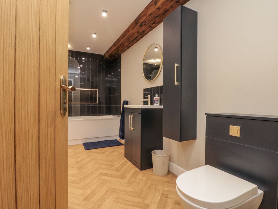A bathroom with a sink and toilet at Betsy's Burrow