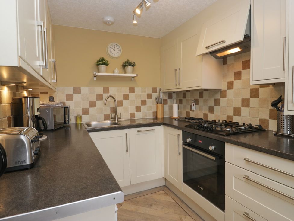 A kitchen with appliances and countertop features at Jenny's in Hawkshead