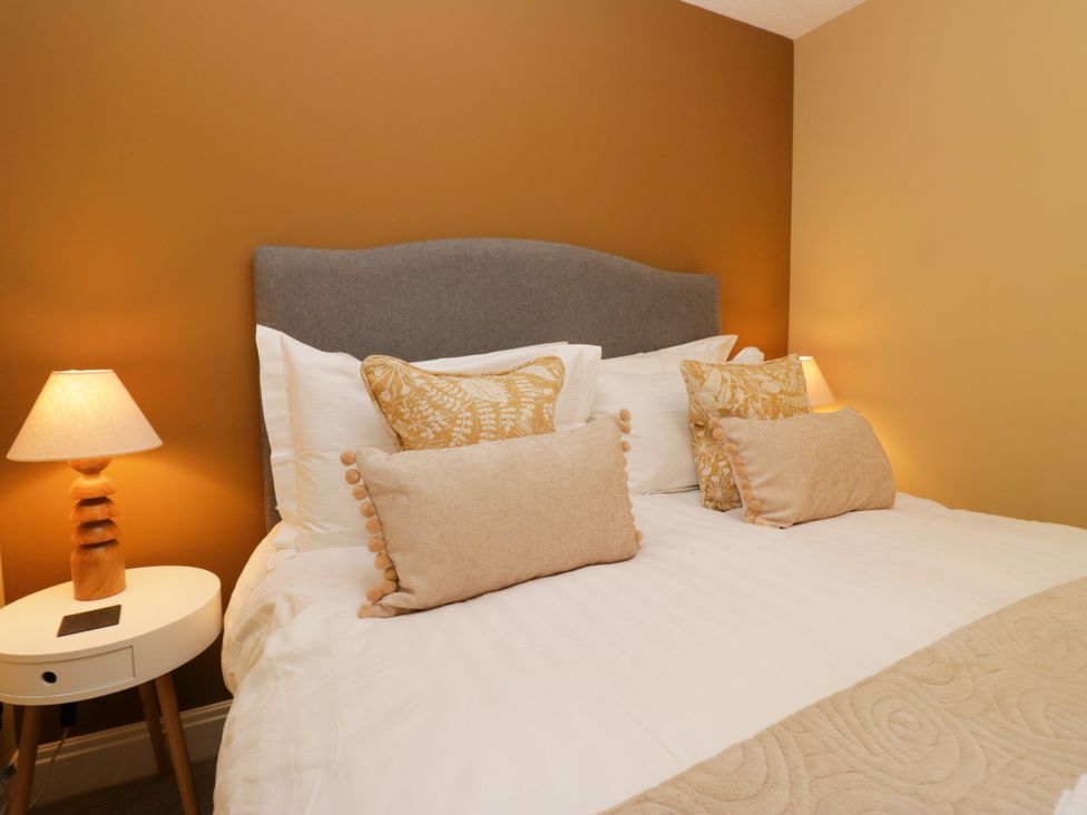 A bedroom with a bed and bedside table at Jenny's in Hawkshead
