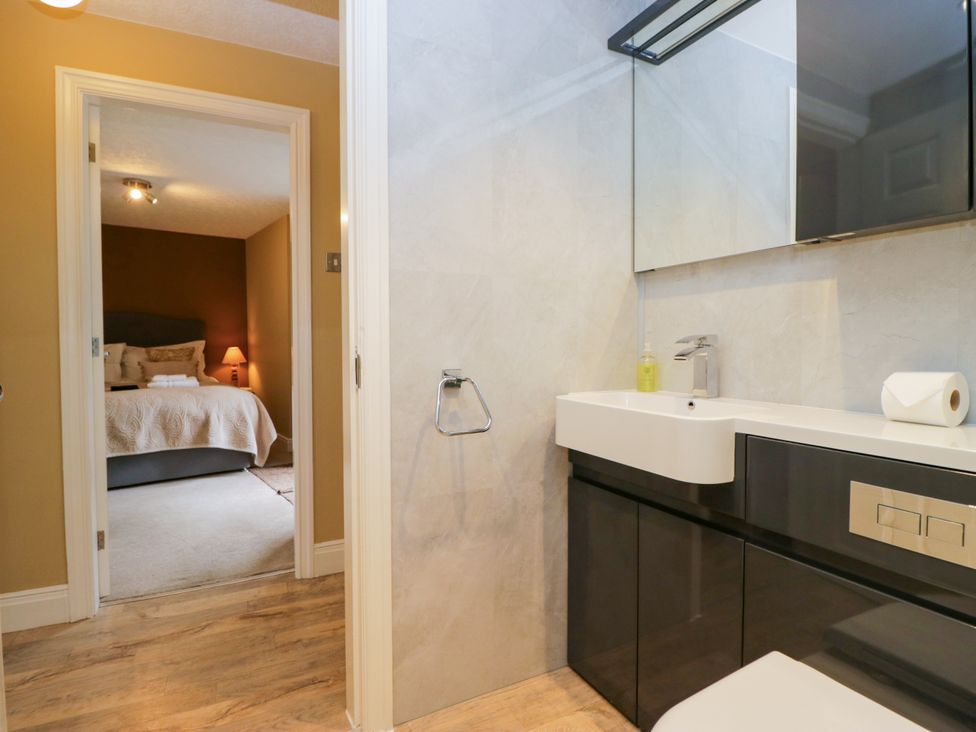 A bathroom with a sink and mirror at Jenny's in Hawkshead