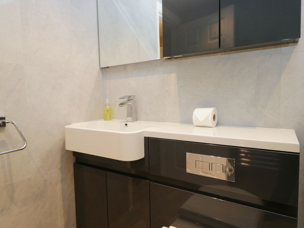 A bathroom with a sink and a mirror at Jenny's in Hawkshead