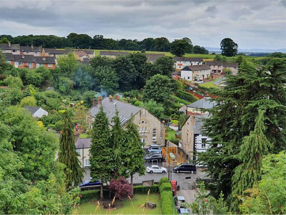 A view of residential houses with gardens and trees at Waterfall Cottage in Dyserth