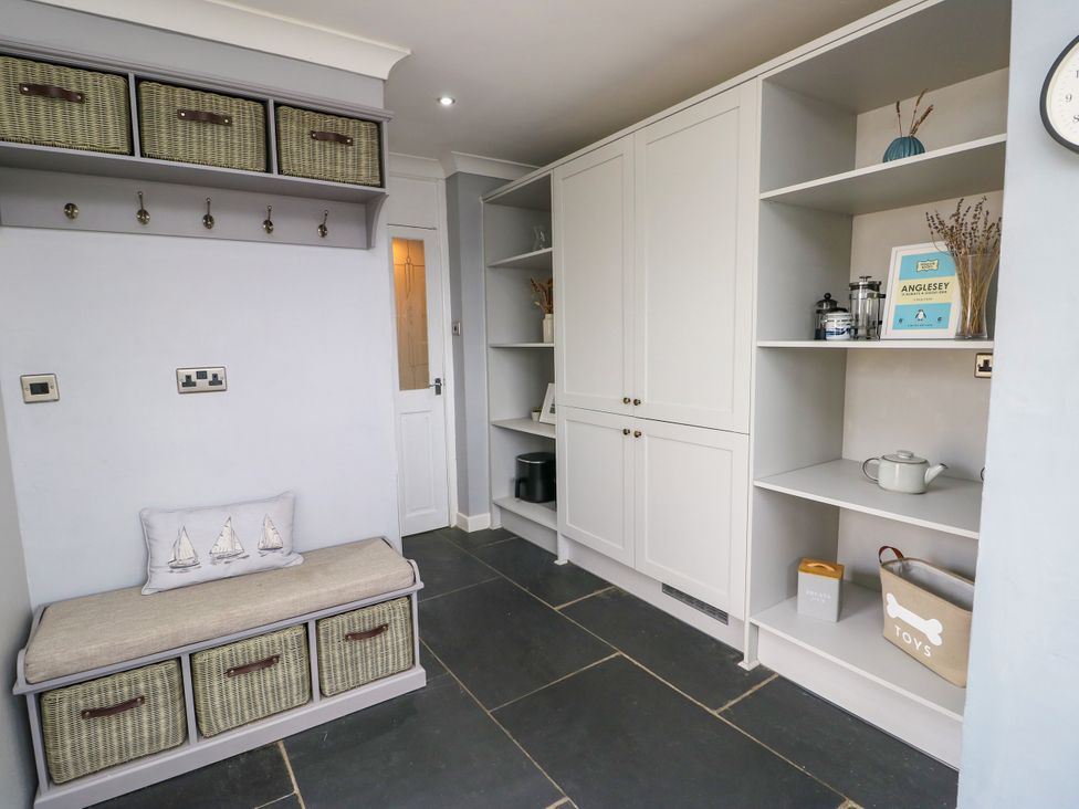 A mudroom with storage bench and shelves at Valley Pines in Valley