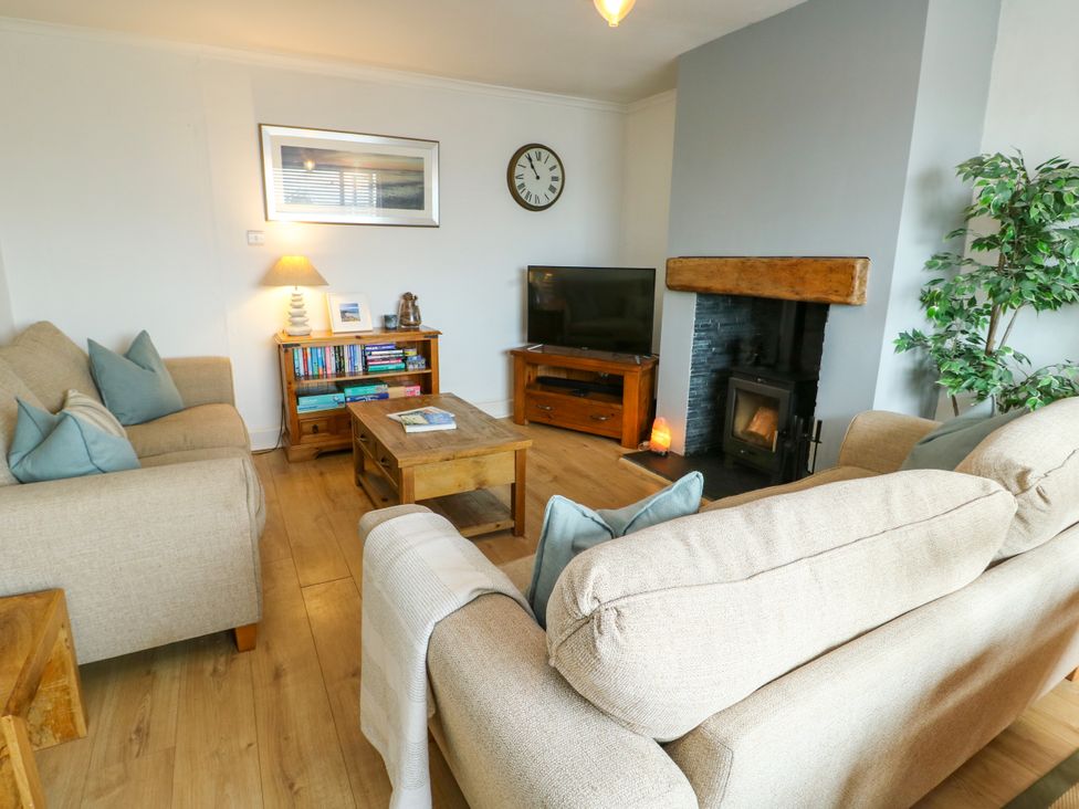 A living room with sofa and fireplace at Valley Pines in Valley