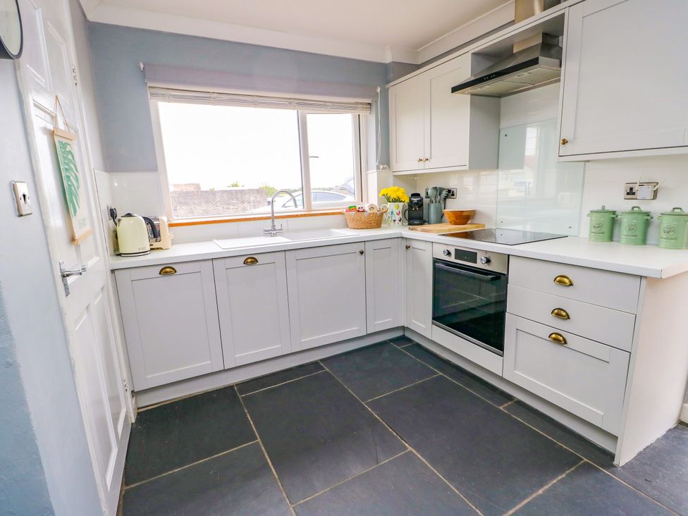 A kitchen with cabinets and a sink at Valley Pines in Valley