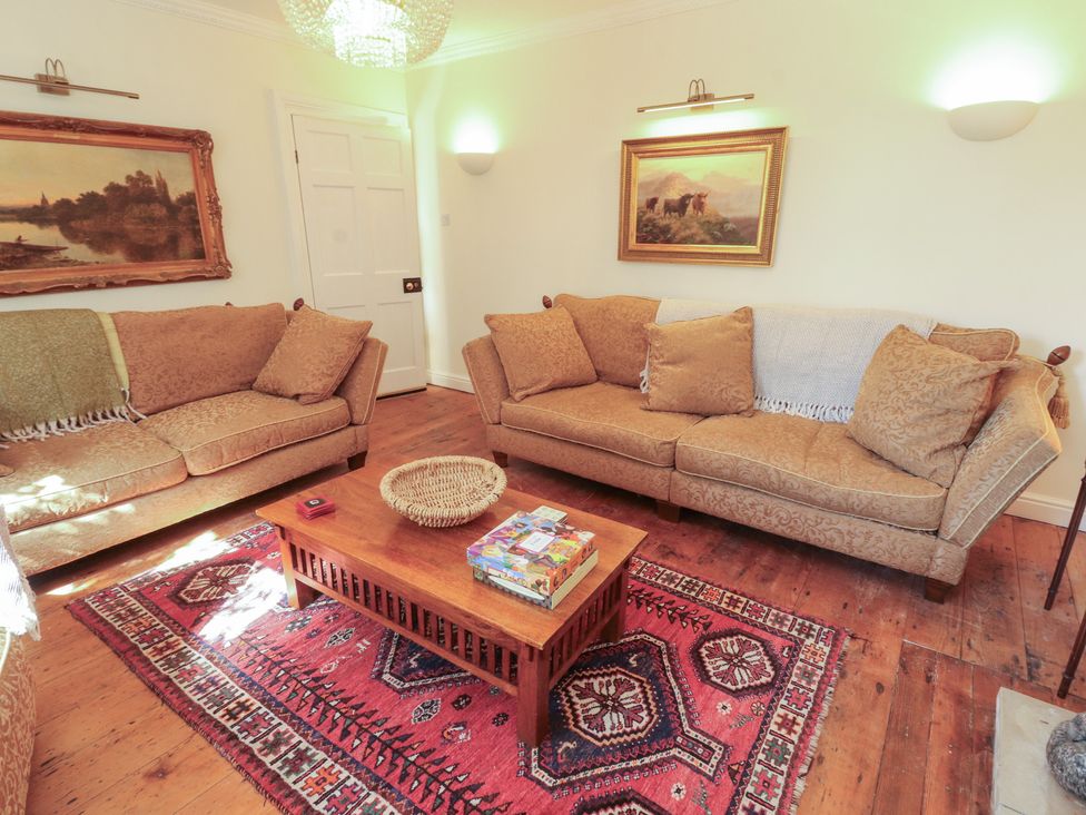 A living room with sofas and a coffee table at Garsdale Foot in Sedbergh