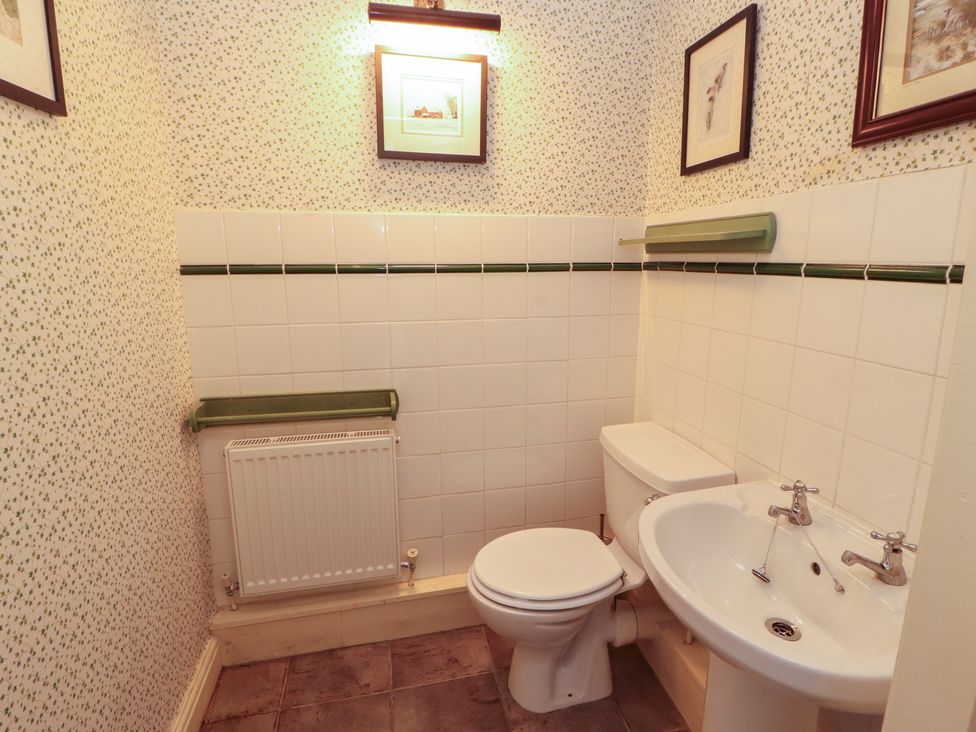 A bathroom with a toilet and sink at Garsdale Foot in Sedbergh