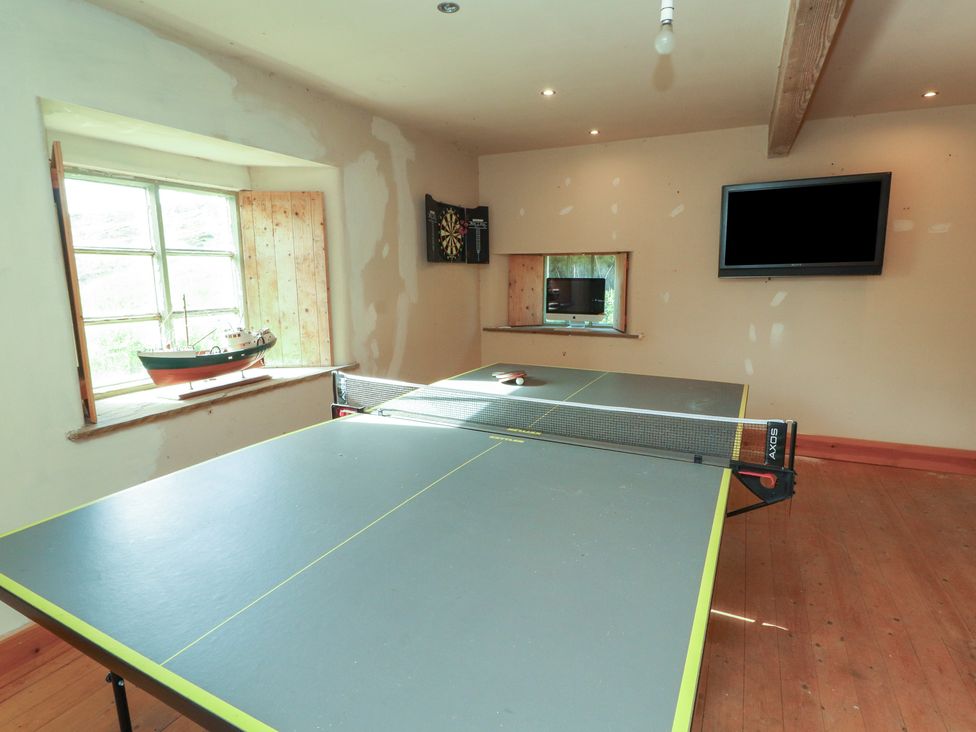 A recreation room with a ping pong table at Garsdale Foot Sedbergh