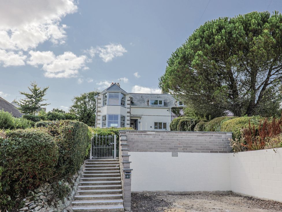 A house with steps and a gate at St Helena, Charmouth