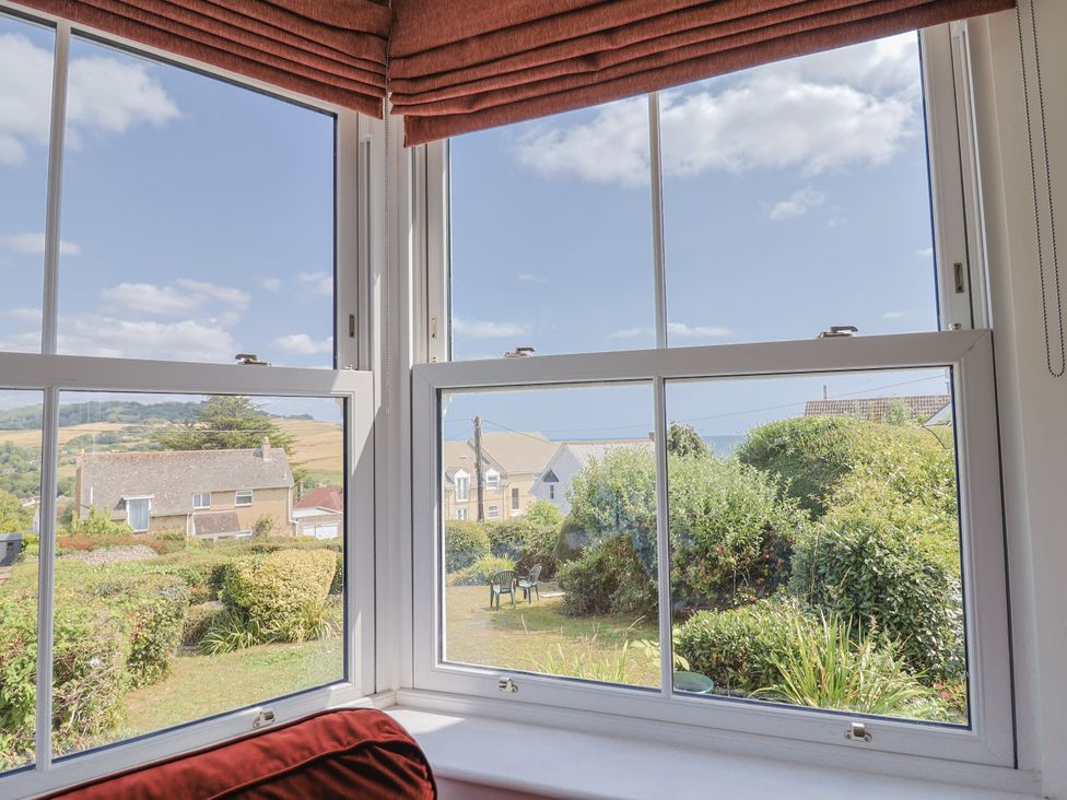 A view from a window showing houses and gardens at St Helena in Charmouth