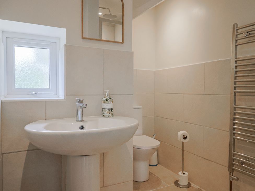 A bathroom with a sink and toilet at St Helena in Charmouth