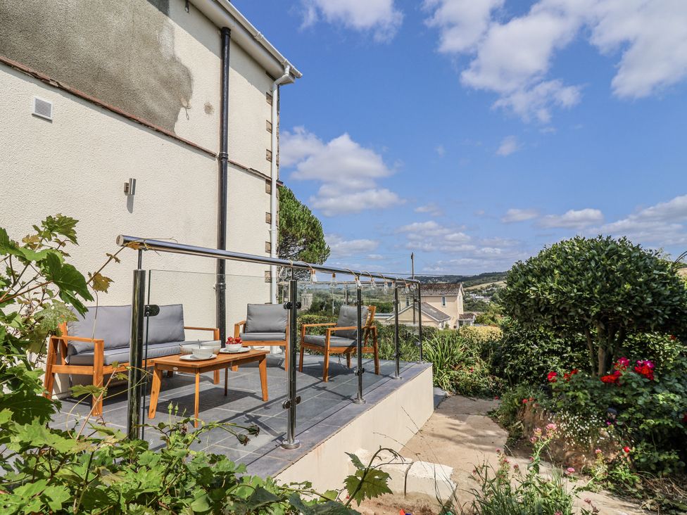 A terrace with seating and plants at St Helena Charmouth