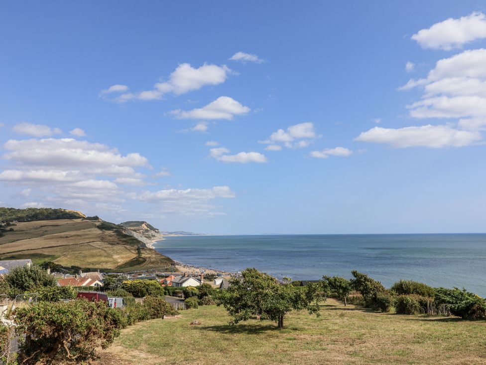 A coastline view with hills and houses at St Helena in Charmouth