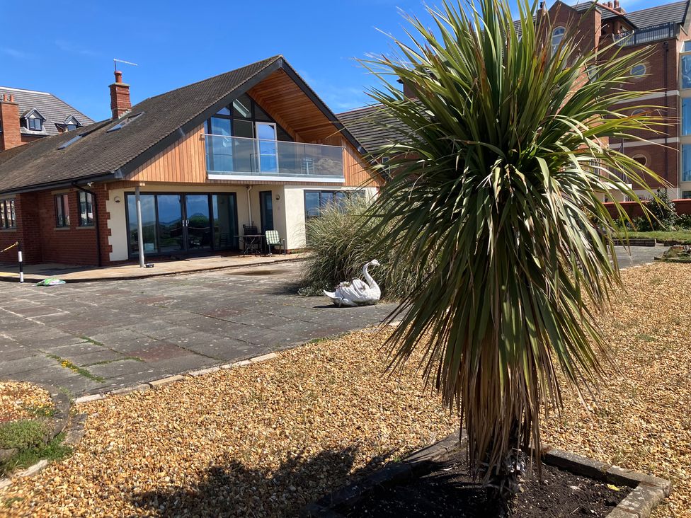 A house with a balcony and garden at Sea La Vie in Lytham St. Annes