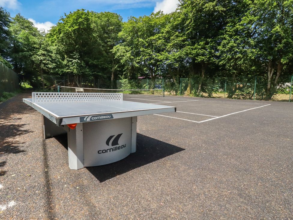An outdoor sports area with a table tennis table at Lilyvale Davidstow near Camelford