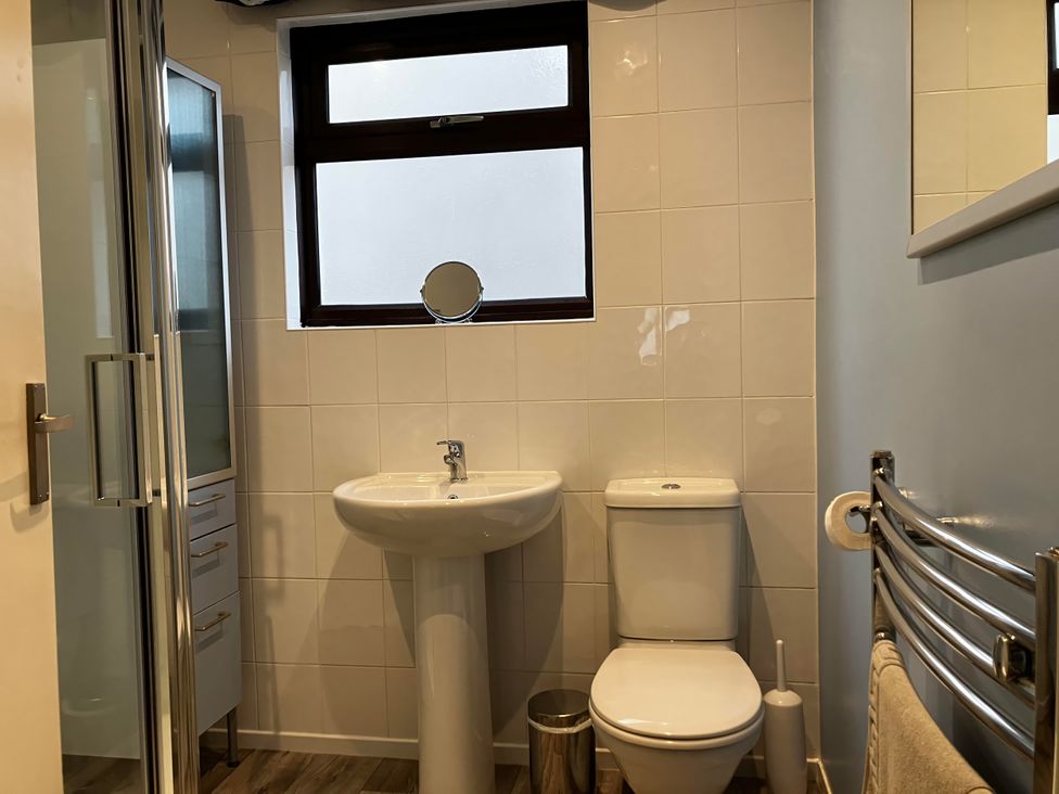 A bathroom with a sink and toilet at Marsh Garth in Kirkby-In-Furness