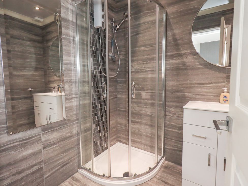A bathroom with a shower and sink at Bowness Central Bowness-On-Windermere