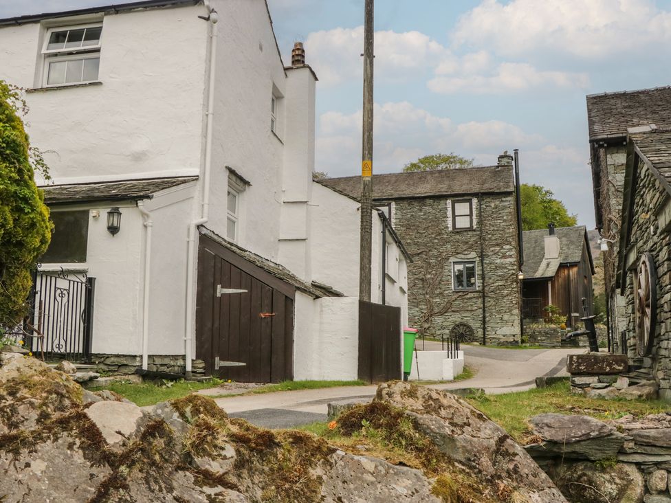 A street view of houses and a road at Woodloft Cottage Elterwater near Chapel Stile