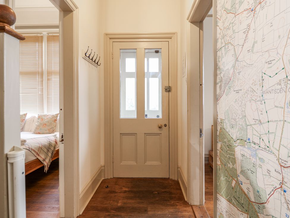 A hallway with a map on the wall at Holly Lodge in Aldeburgh