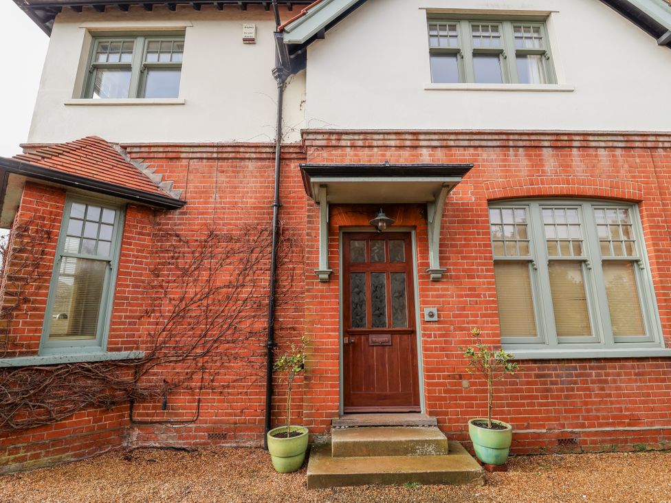 A front entrance with a door and windows at Holly Lodge in Aldeburgh